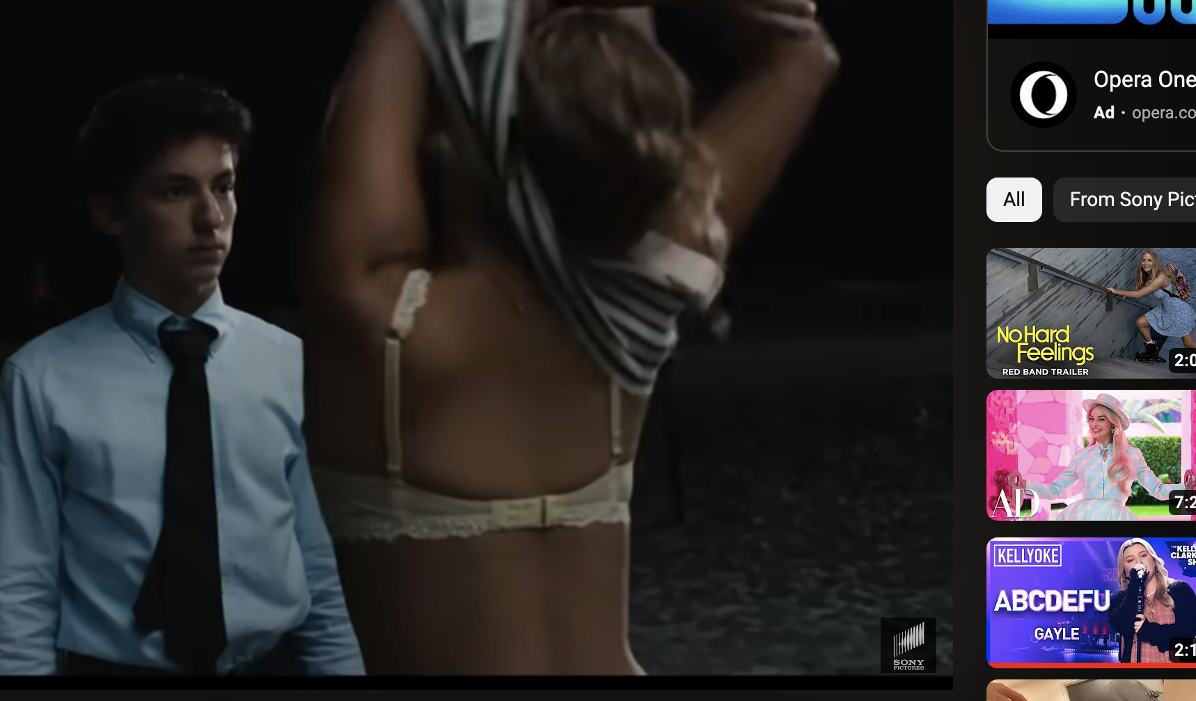 Maddie takes her top off as Percy looks on in a scene from the film