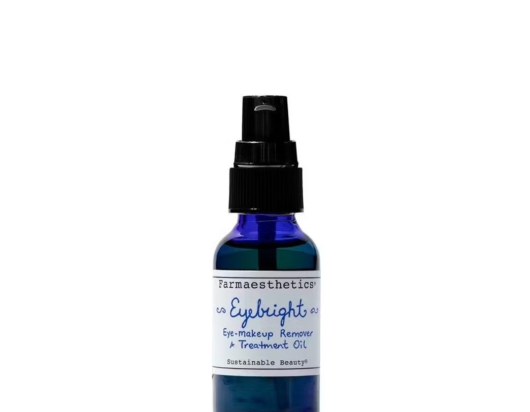 A blue bottle of eye makeup remover and oil