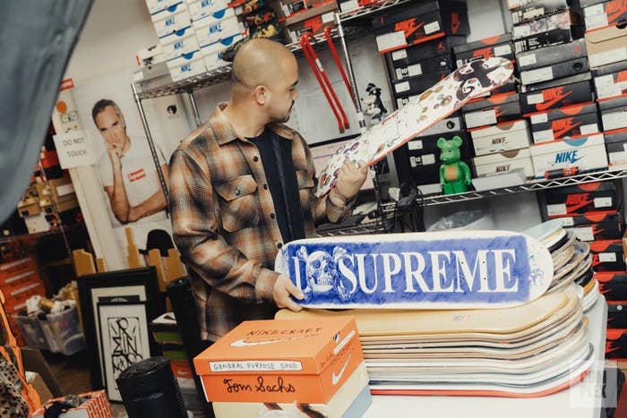 Jeffrey Malabanan showcasing RIF LA&#x27;s extensive collection of Supreme skateboard decks.