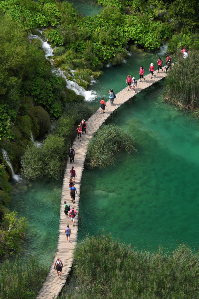 People walking on a bridge in Plitvice Lakes National Park