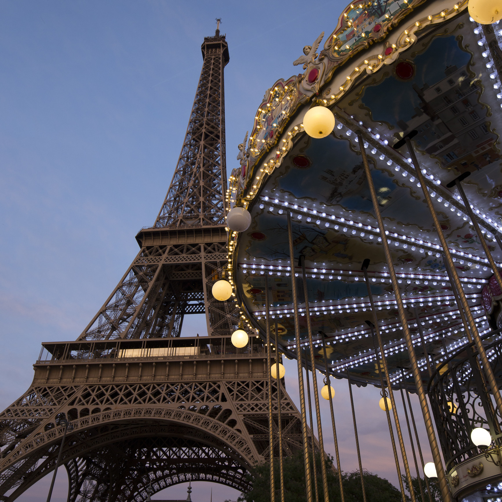 Eiffel Tower and carousel in Paris at dusk