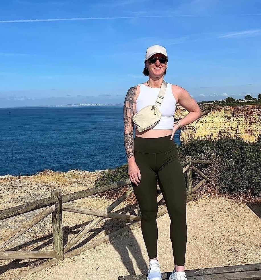 a reviewer wearing the black leggings while hiking