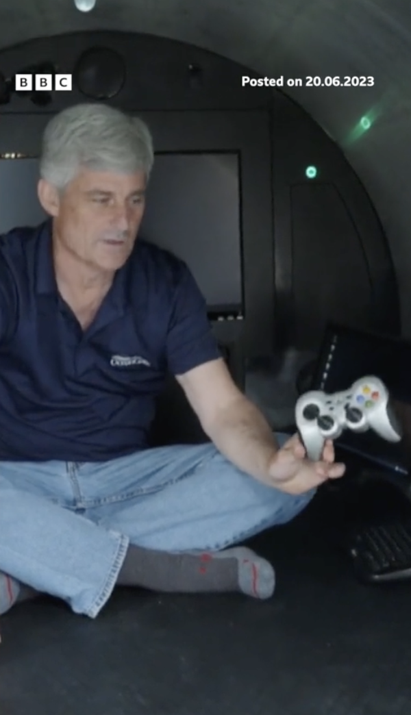 he holds up the controller