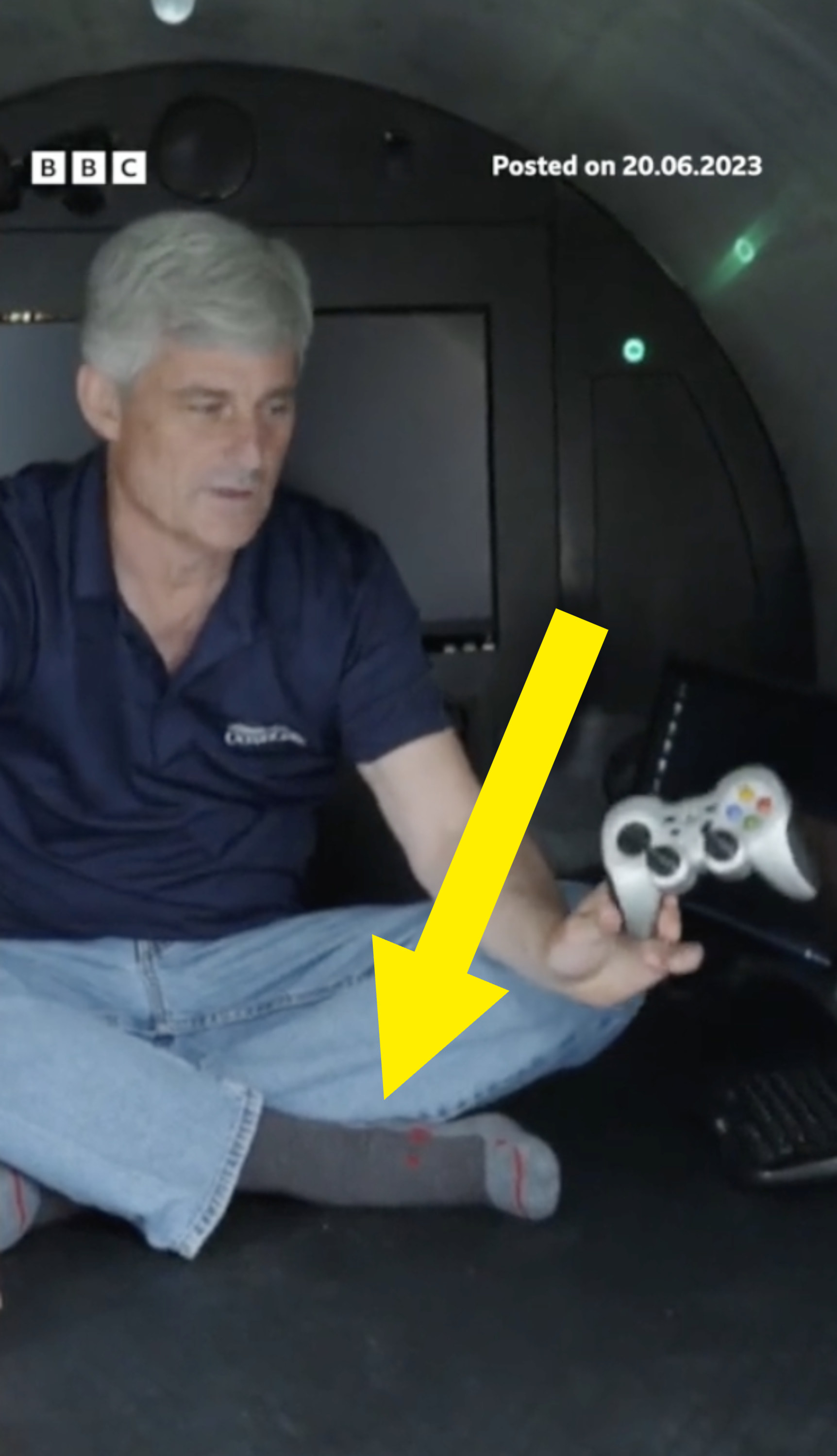 arrow pointing to his socked feet