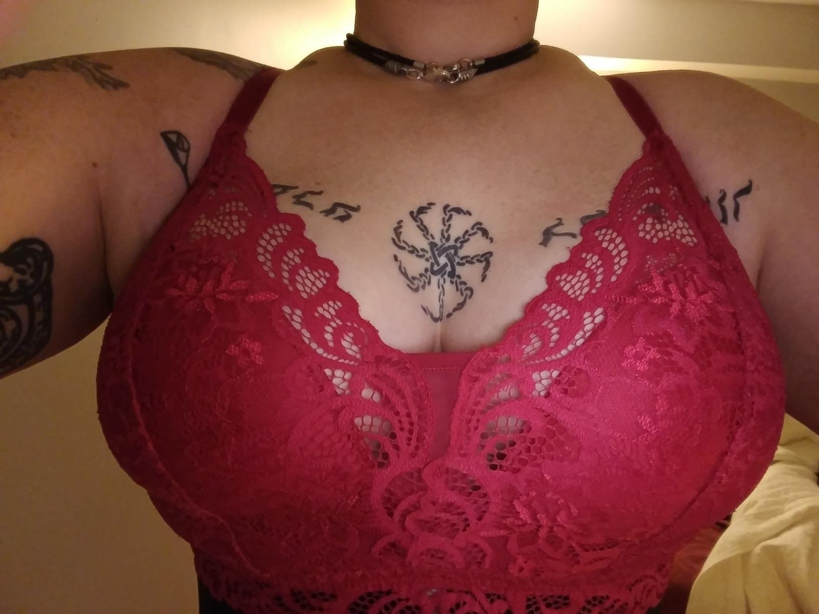 a reviewer wearing the red lace bra