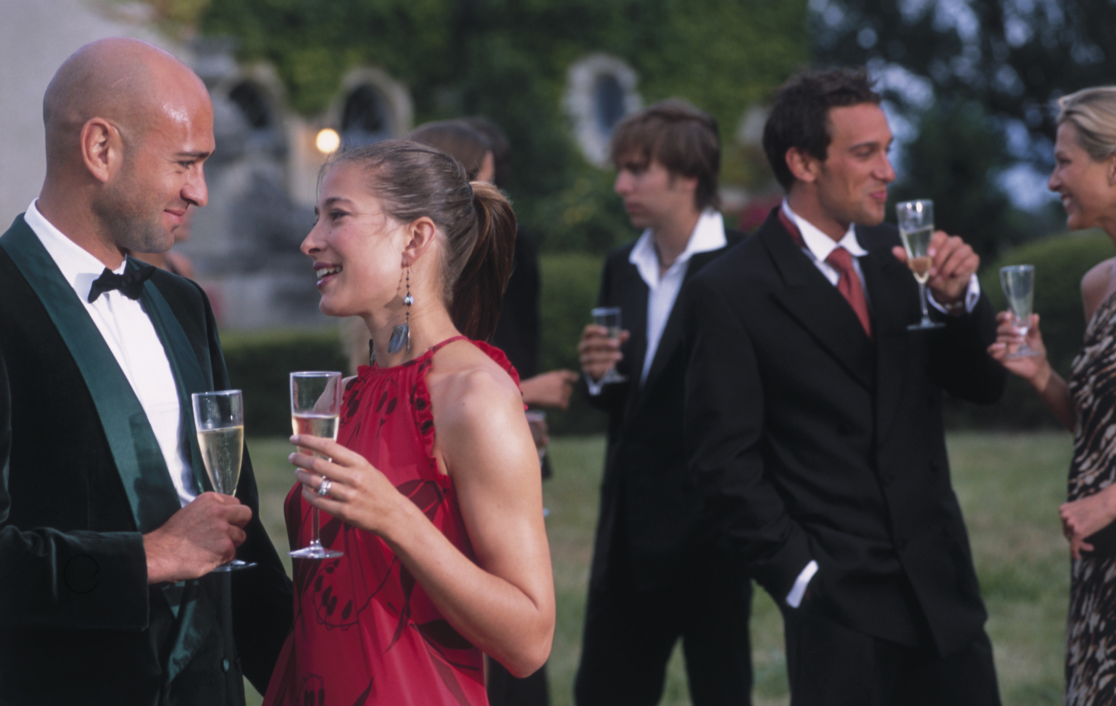 People drinking champagne at a fancy event