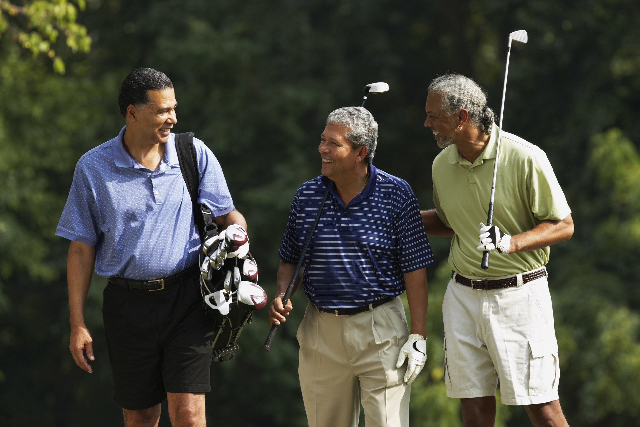Men smiling and golfing
