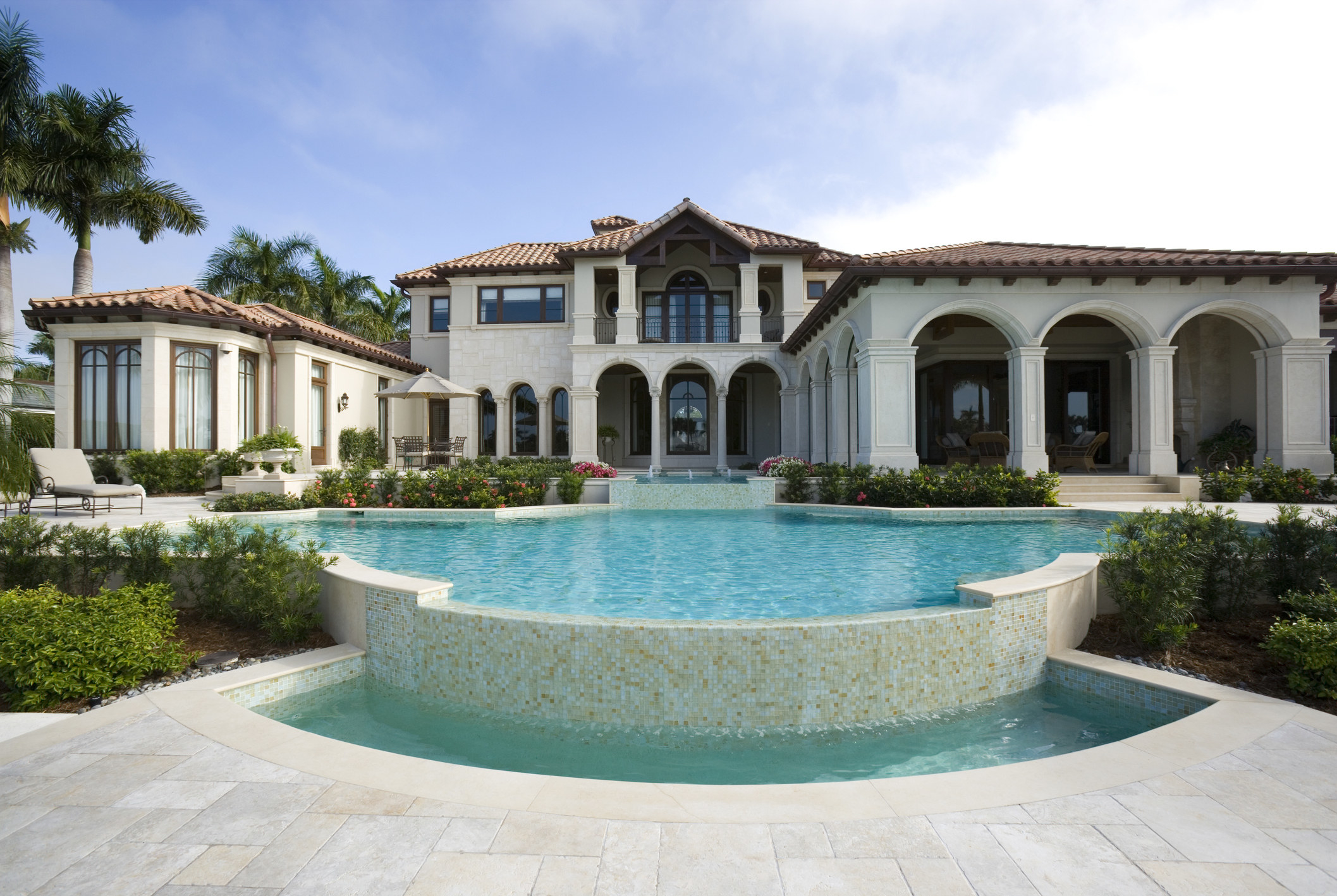 A mansion with a pool