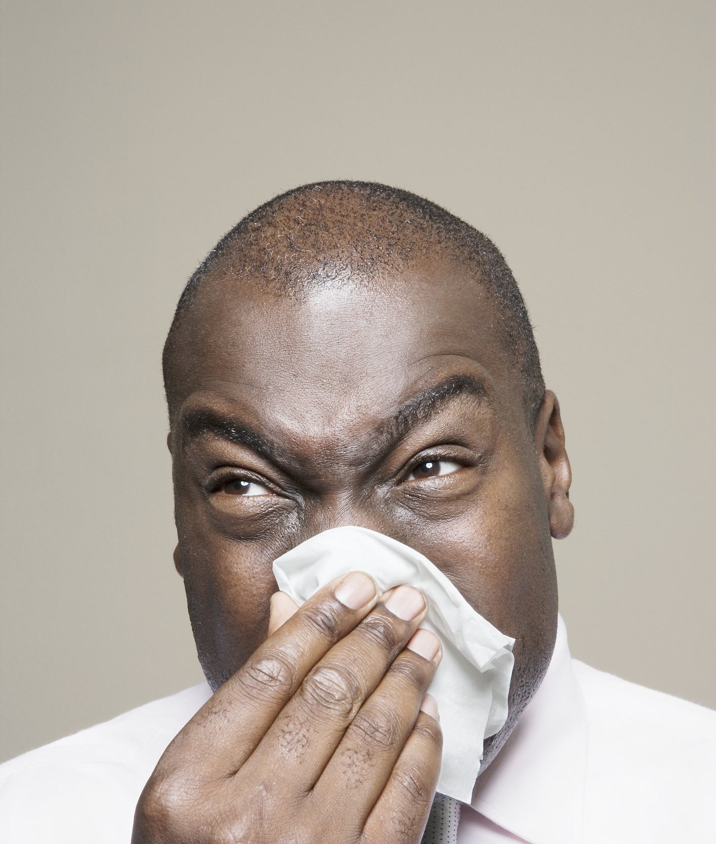 A man blowing his nose
