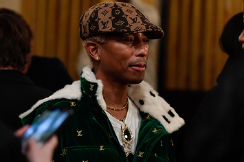Pharrell wearing Louis Vuitton
