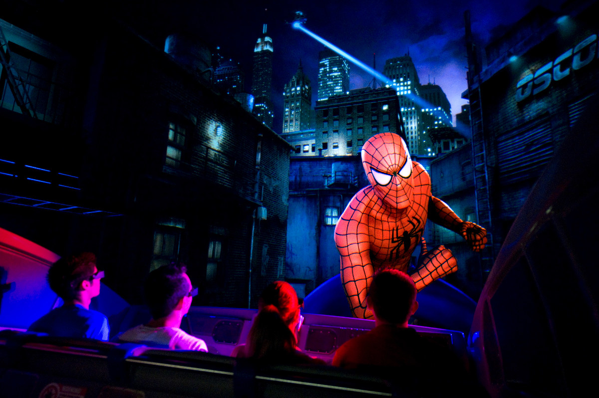 A group of riders watch Spider-Man on screen at &quot;The Amazing Adventures of Spider-Man&quot;