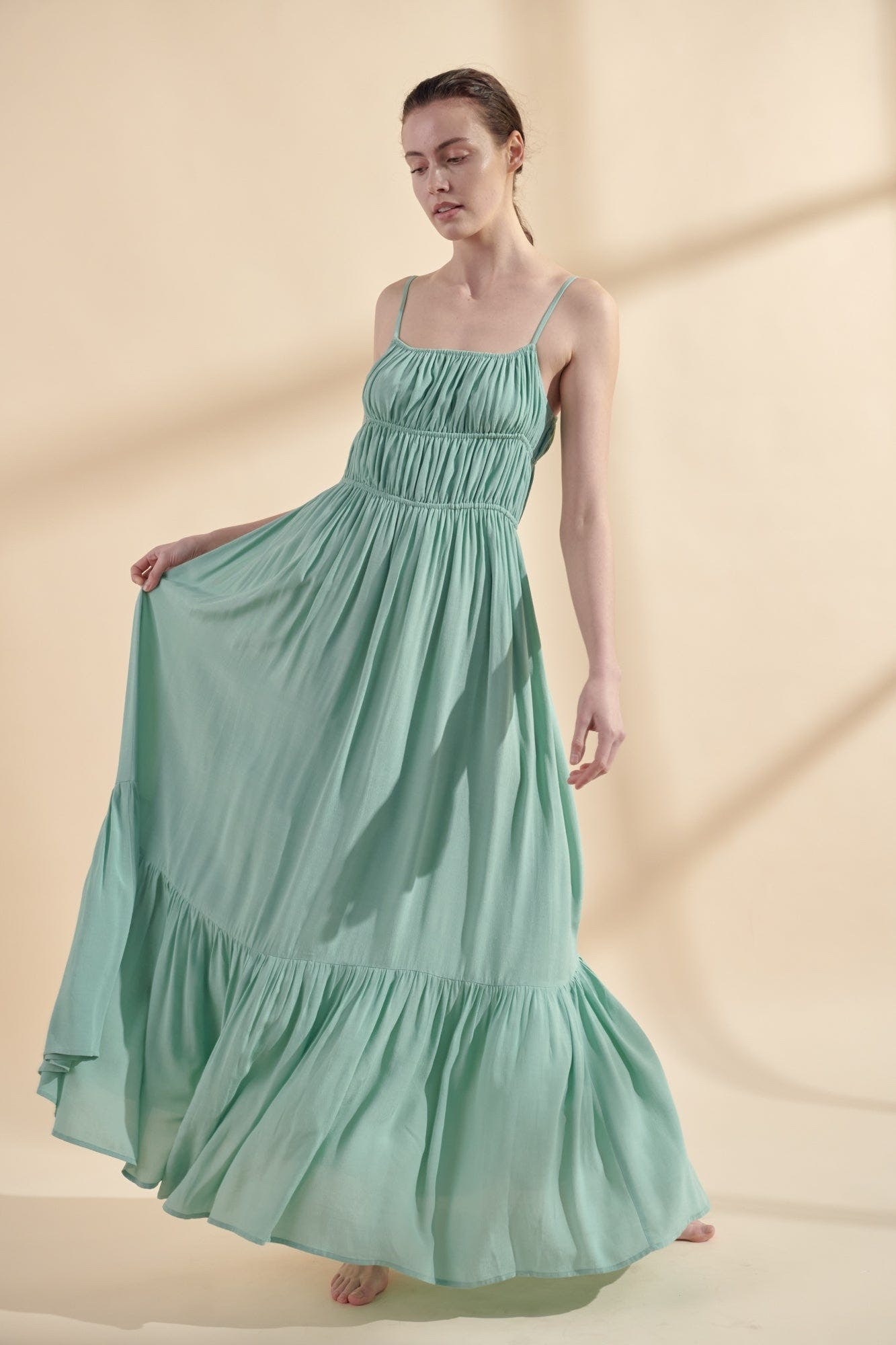 Image of model wearing the green dress