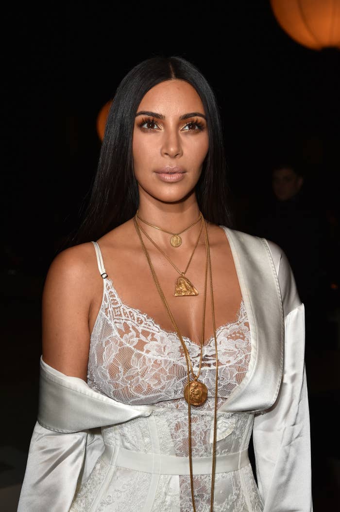 Close-up of Kim in a lacy see-through outfit