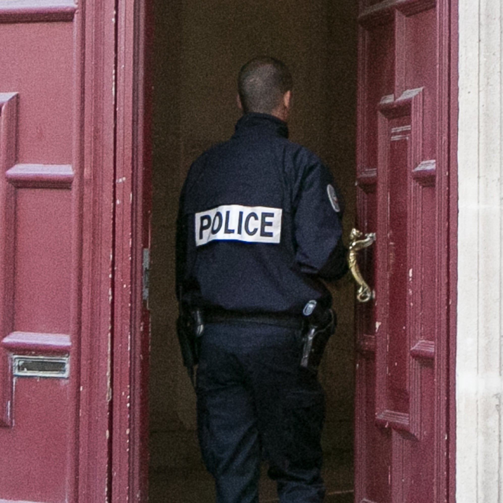 A police officer going into a building