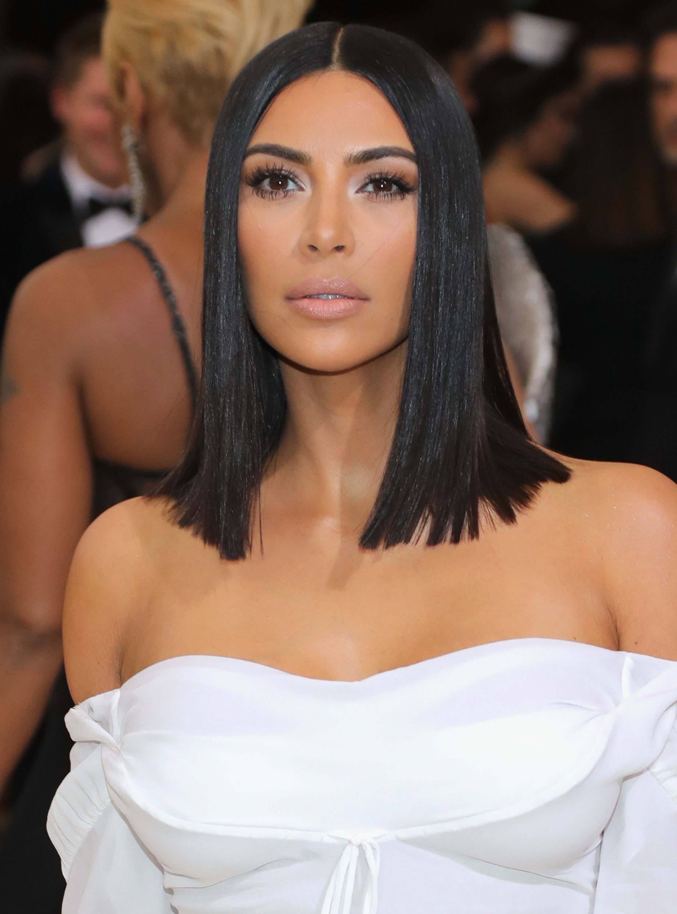 Close-up of Kim wearing an off-the-shoulder outfit