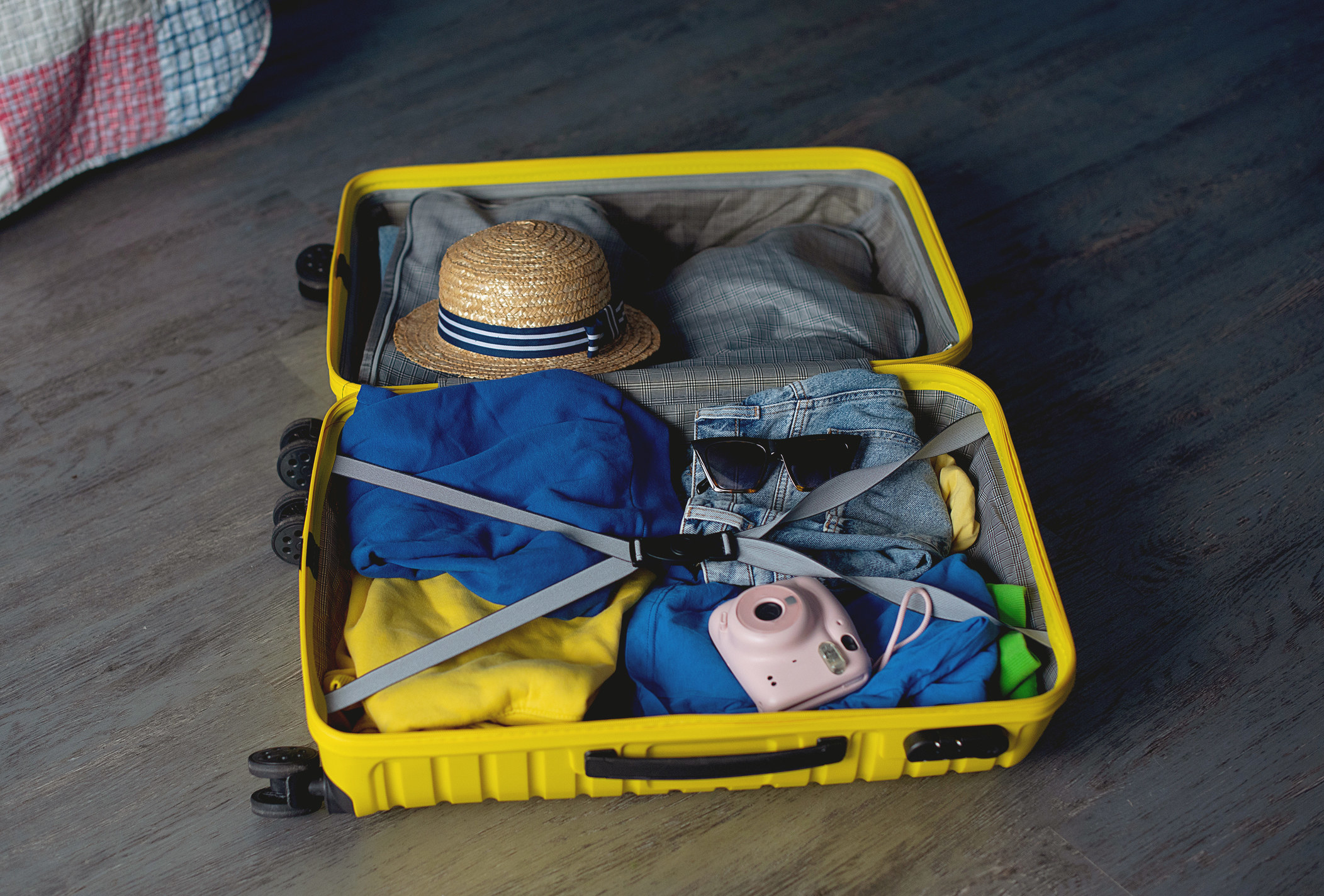 An opened suitcase with items in it
