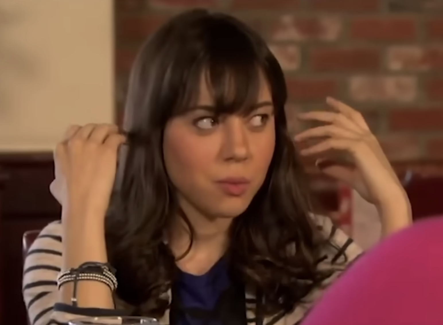 woman with hands up in shock