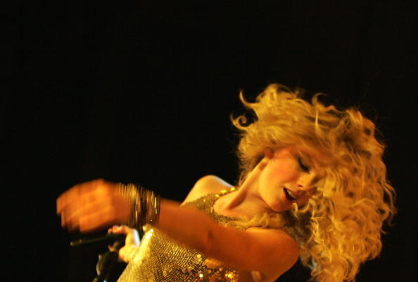 Taylor Swift waving her hair onstage