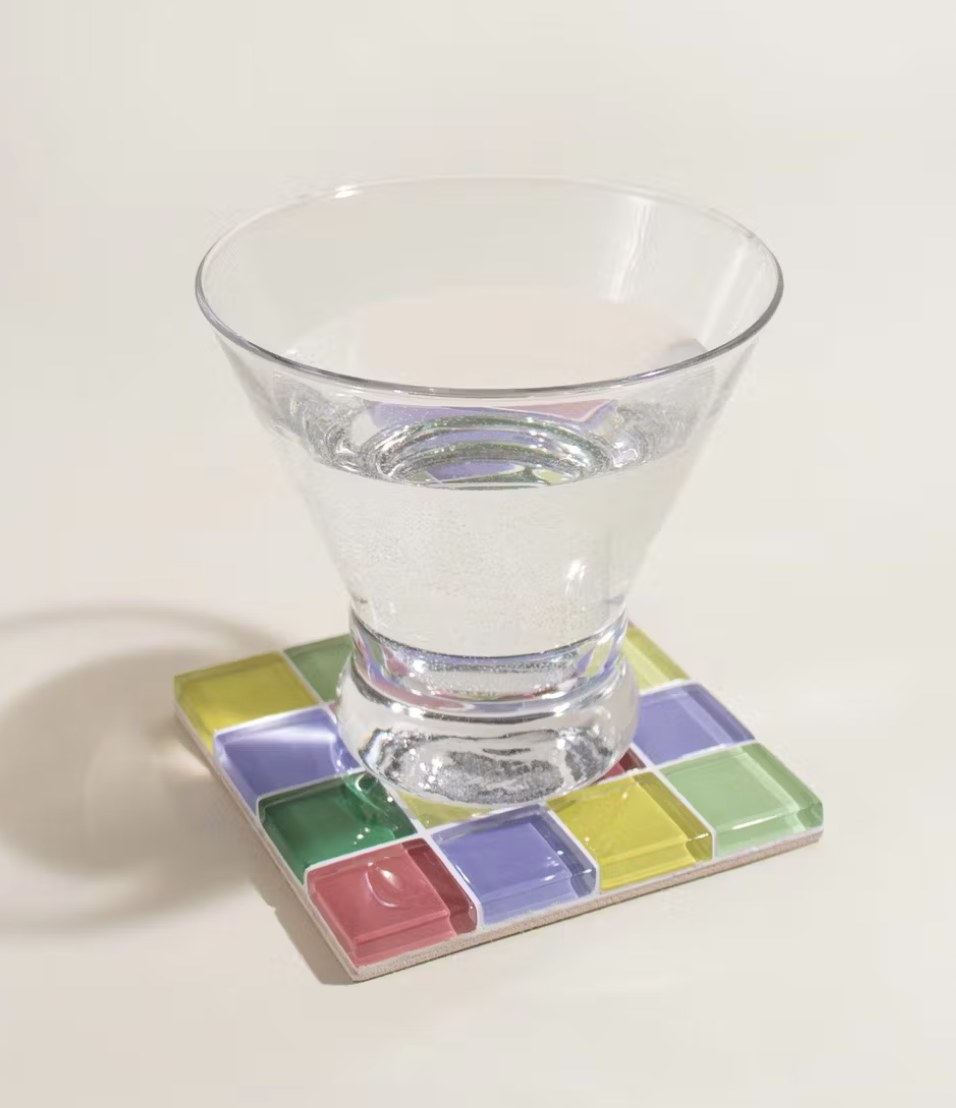 The coaster with glass of water on it
