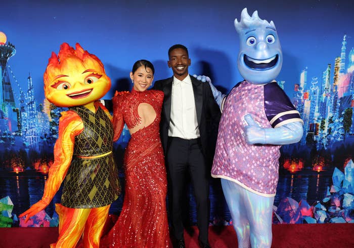 Leah Lewis and Mamoudou Athie on the red carpet with their mascot characters