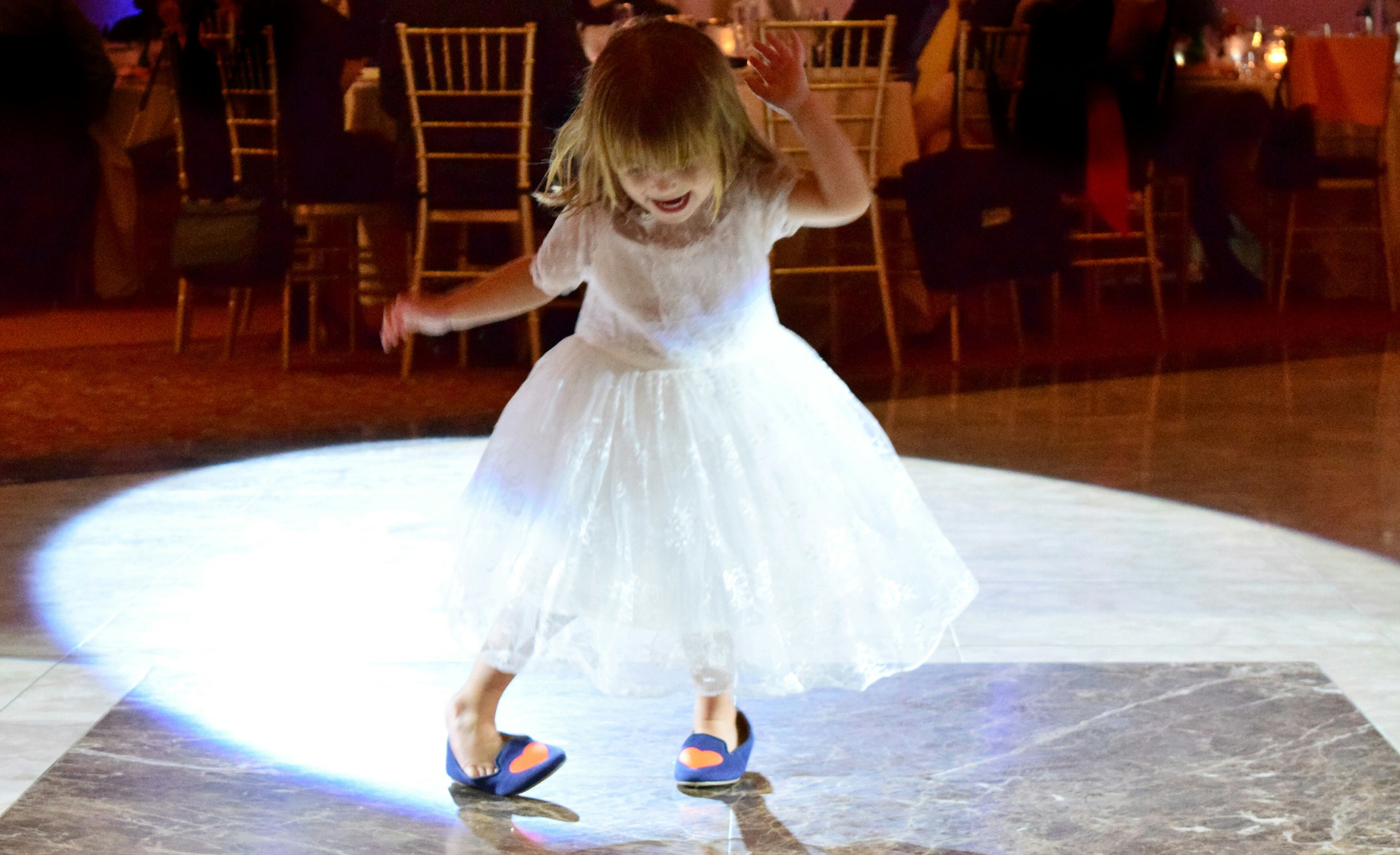 A little girl dancing on the dance floor