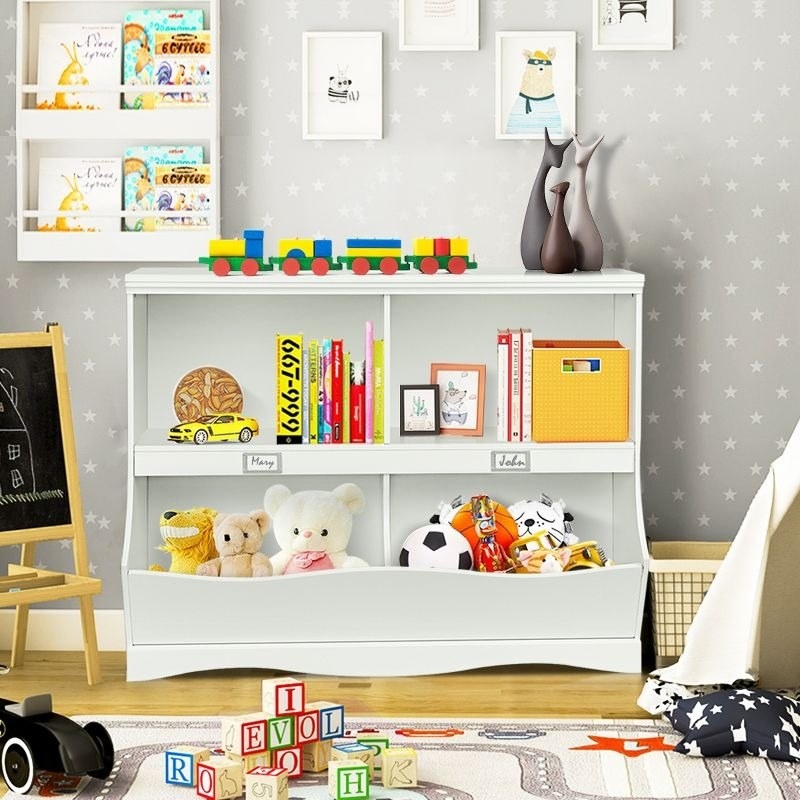 A bookcase holds books and toys