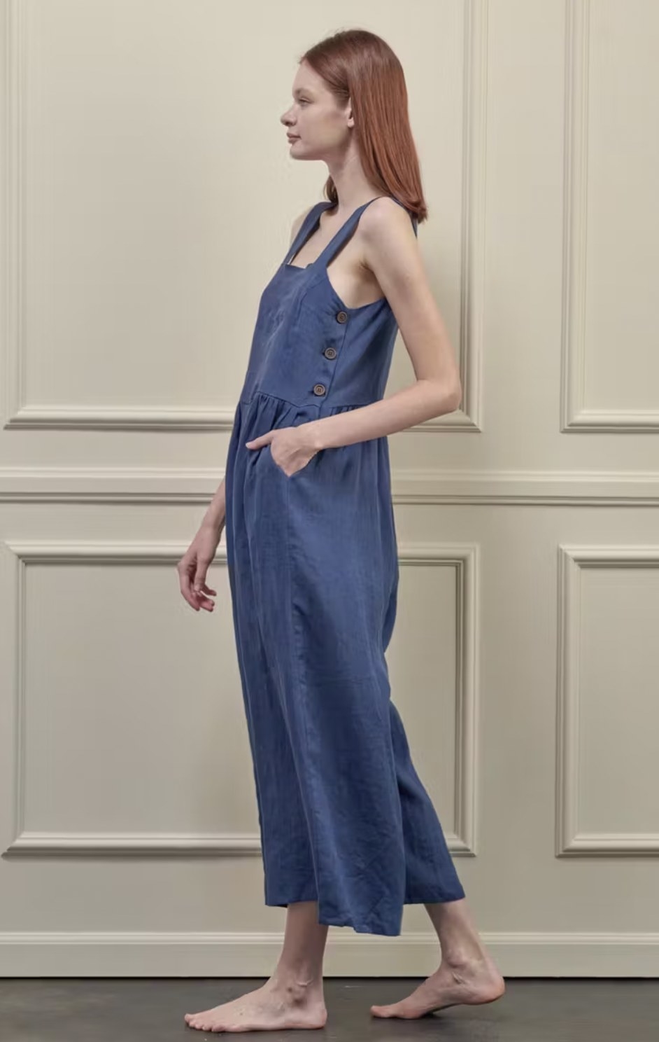 model in the blue jumpsuit from side angle