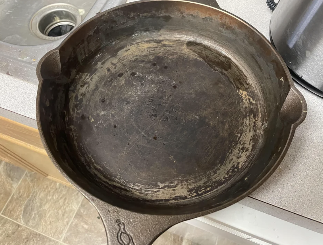 A scraped and ruined cast iron skillet