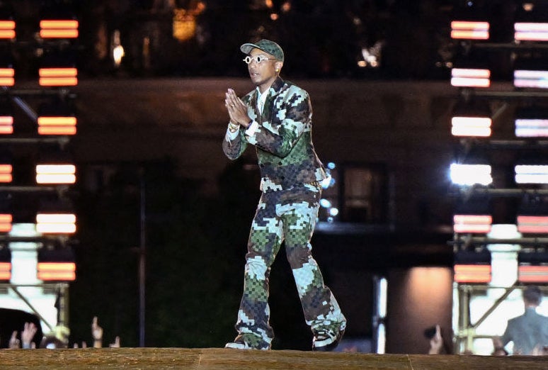 Pharrell closing out the Louis Vuitton show in a pixelated fatigues-type suit