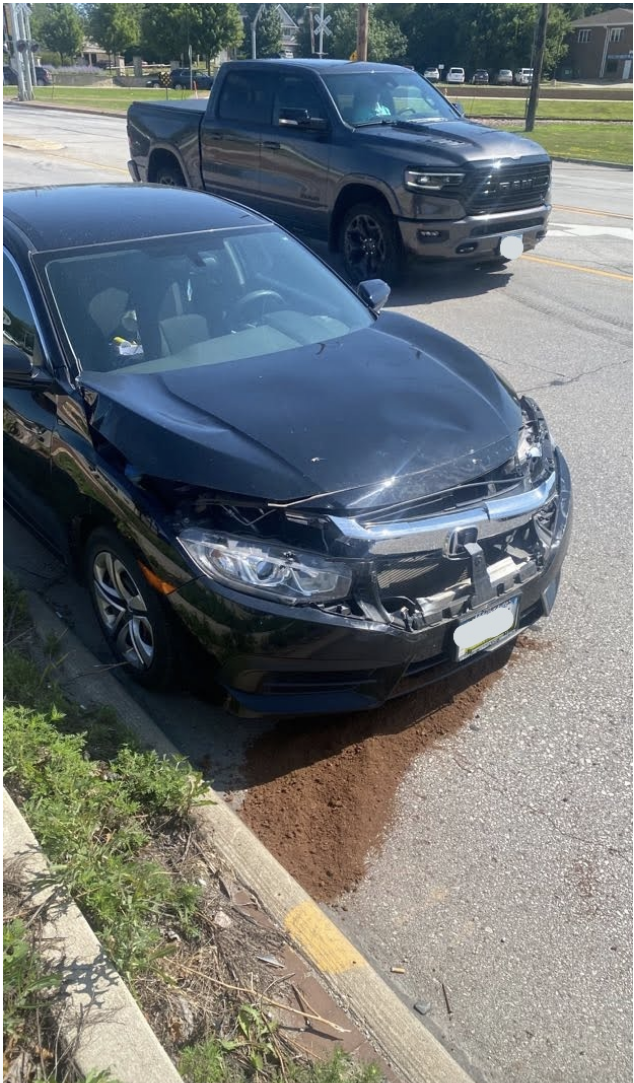 A car with the front bumper smashed up