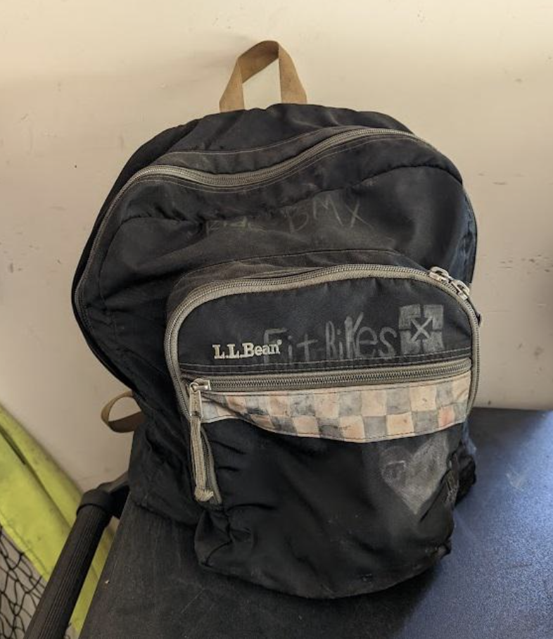 An old, beat-up backpack