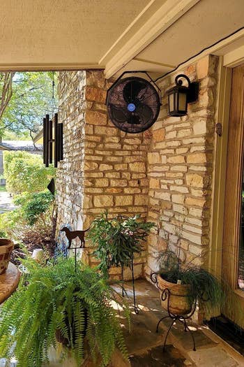 the outdoor fan mounted in a corner on a patio