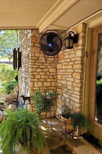 the outdoor fan mounted in a corner on a patio