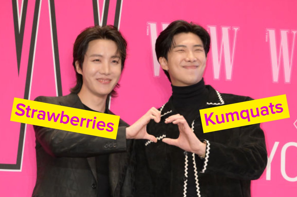 BTS members making a heart with their hands.