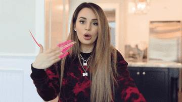 a woman with very long nails