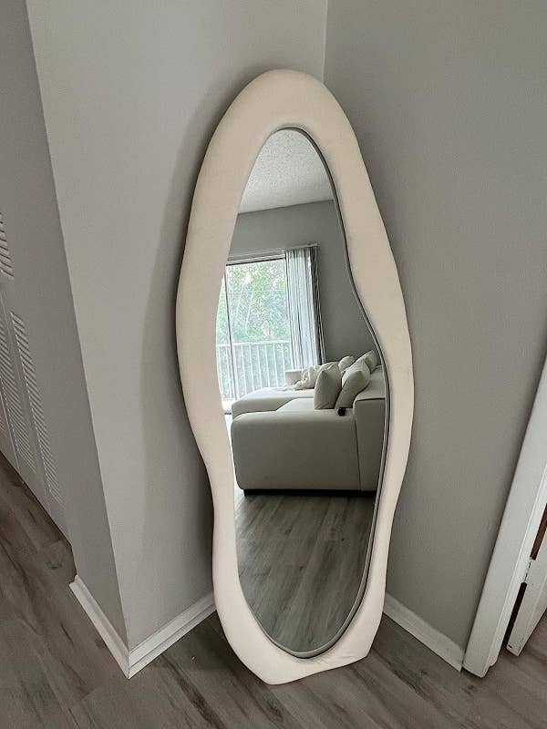 a reviewer&#x27;s white mirror sitting on the floow