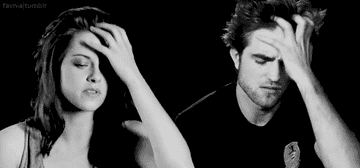 Kristen Stewart and Robert Pattinson rub their heads simultaneously