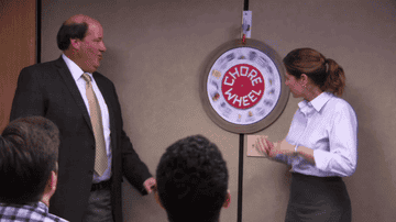 pam and kevin with the chore wheel on the office