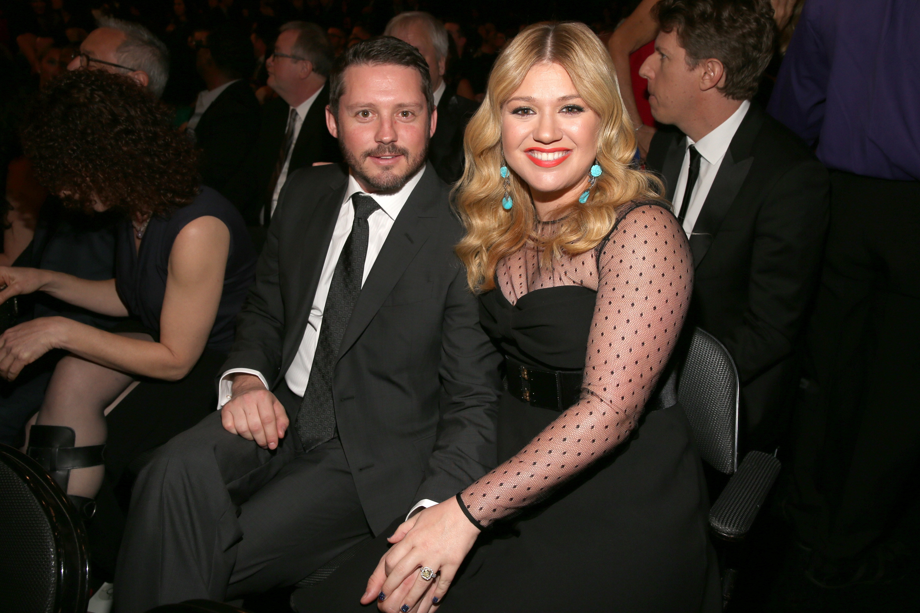 Close-up of Brandon and Kelly sitting together and smiling