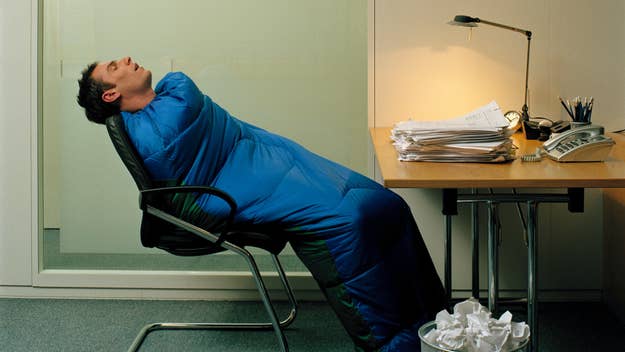 man in sleeping bag at work