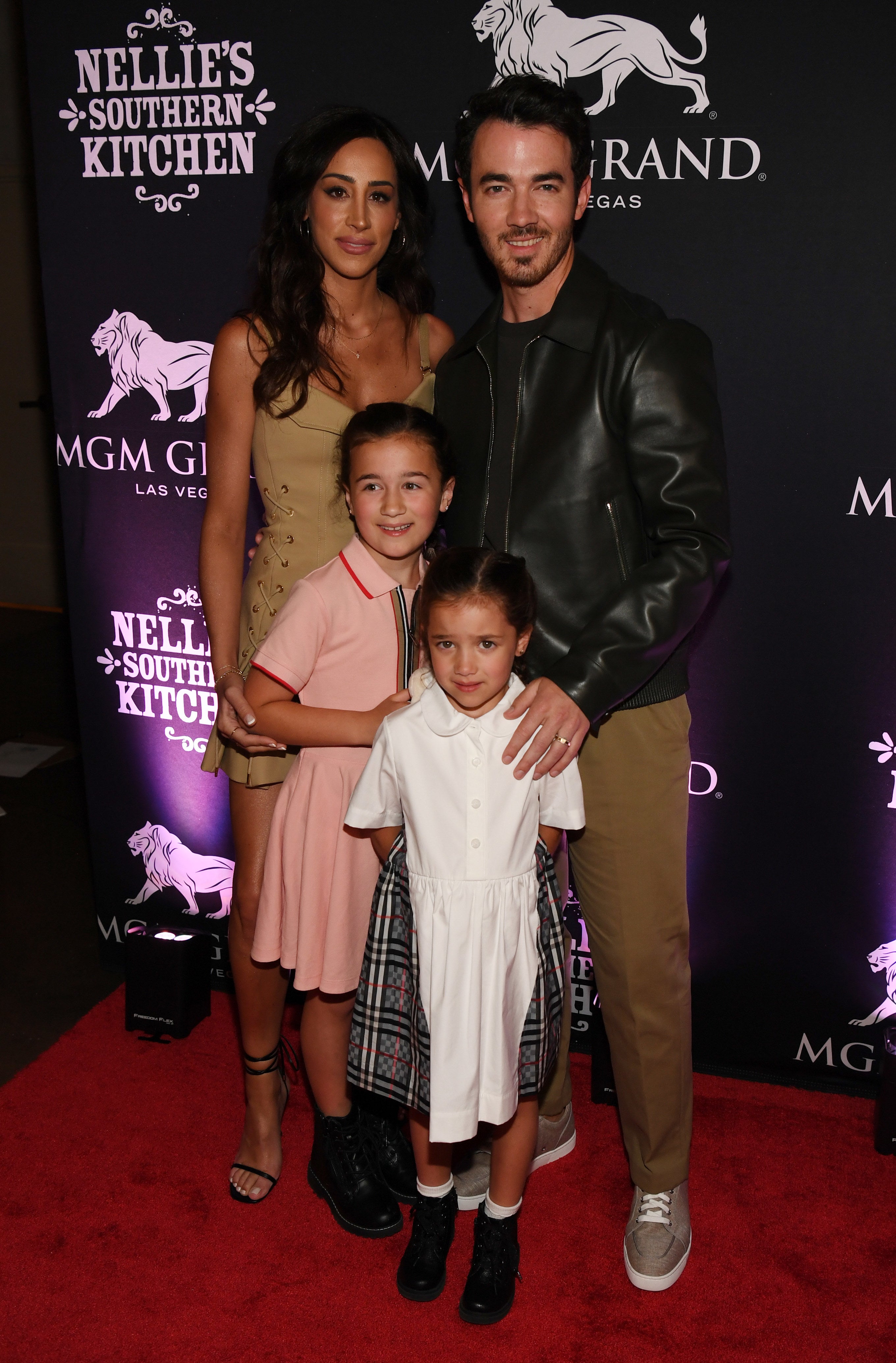 Kevin with his family on the red carpet
