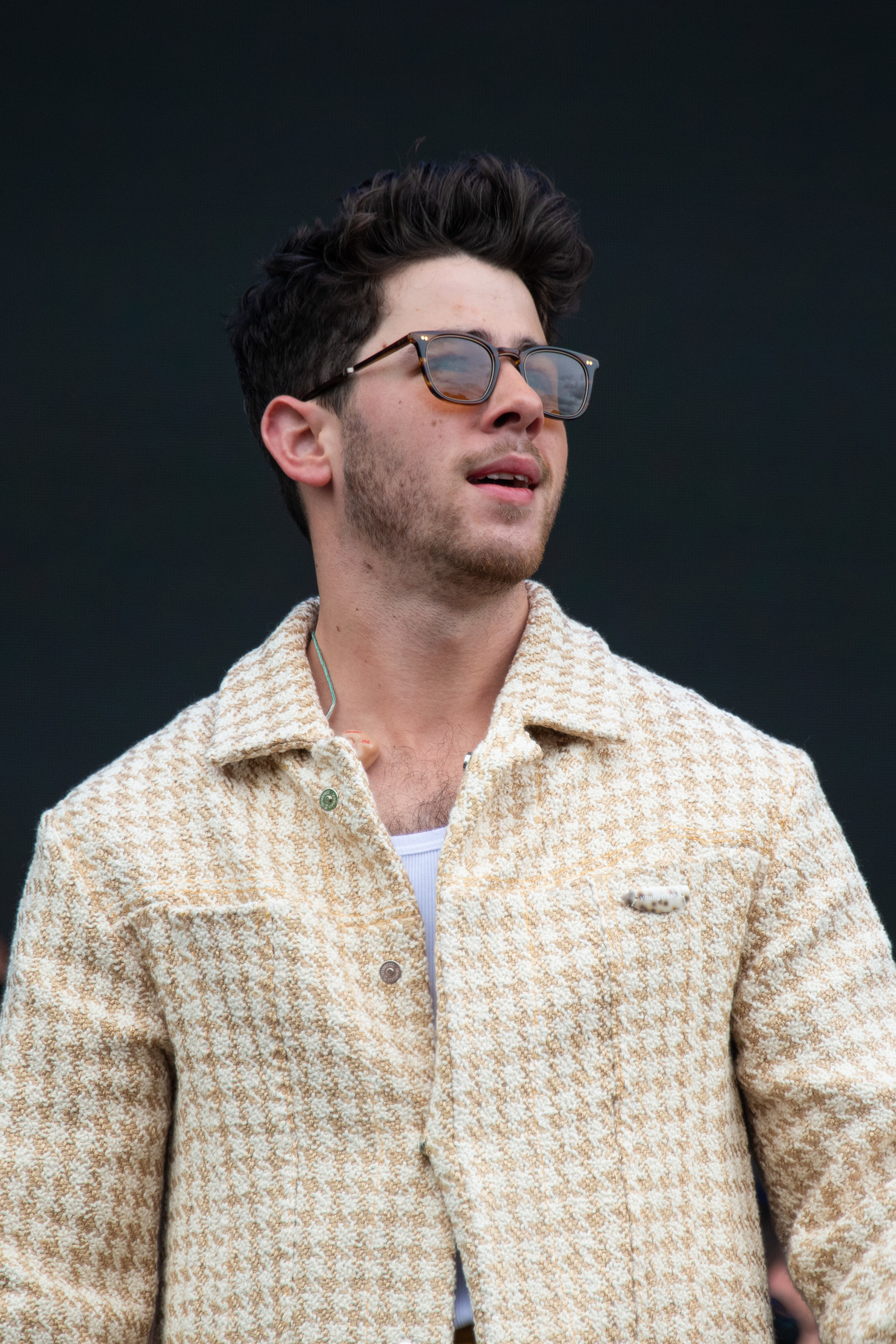 Close-up of Nick in a checkered jacket