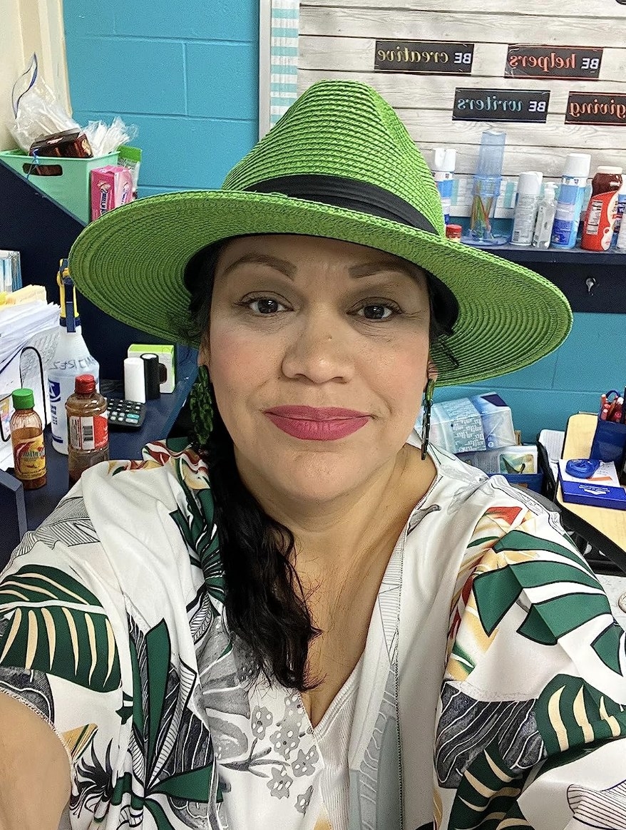 A person wearing the hat in green