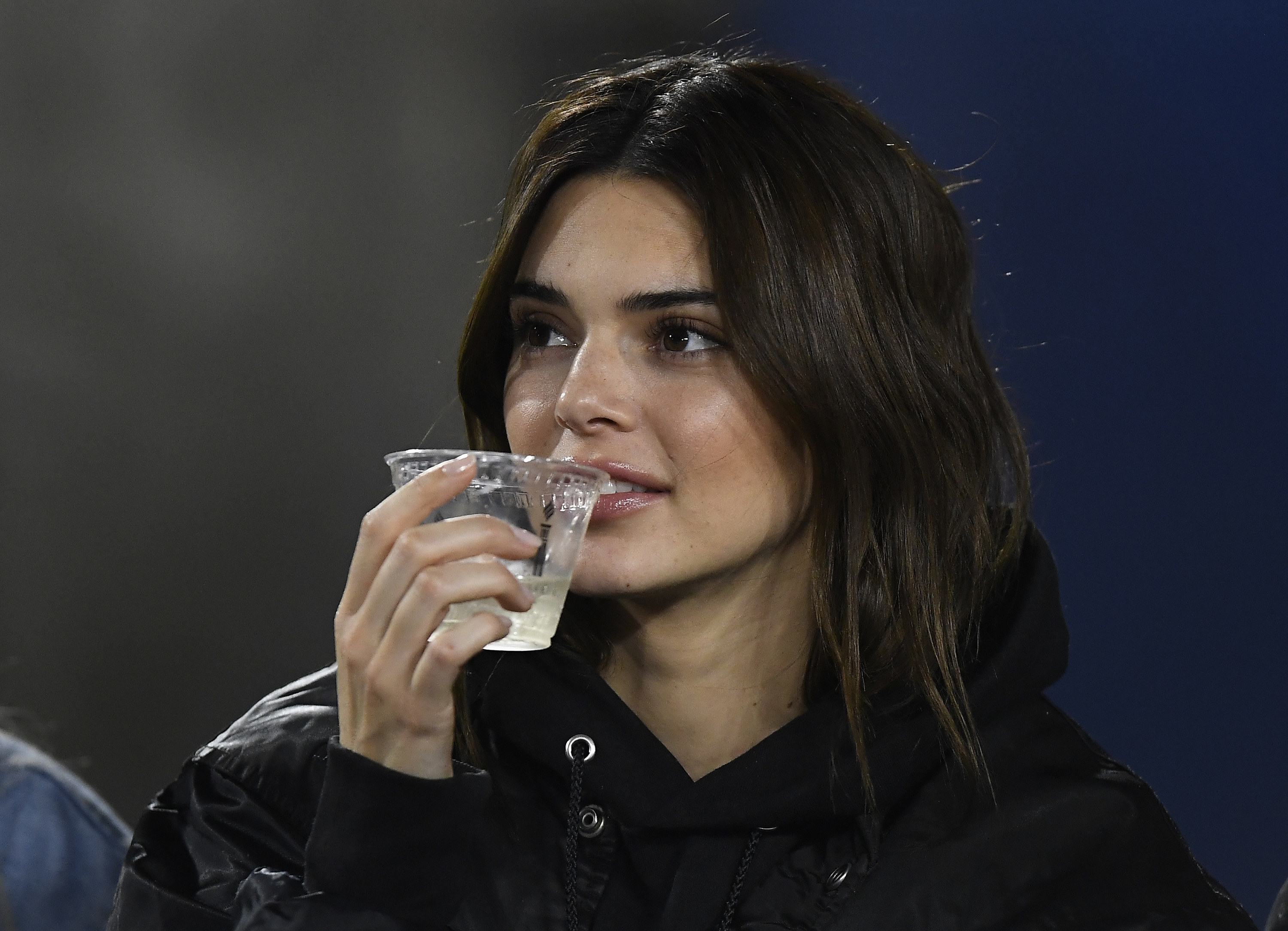 Closeup of Kendall Jenner drinking a drink