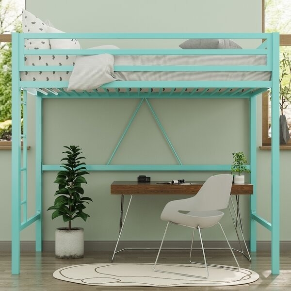 A loft bed with a desk underneath