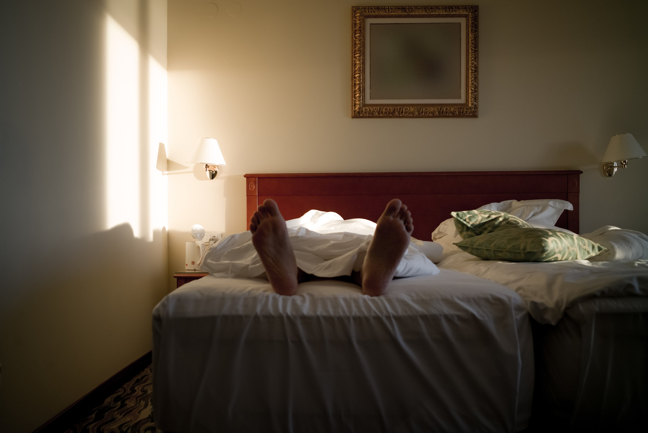 body on a hotel bed