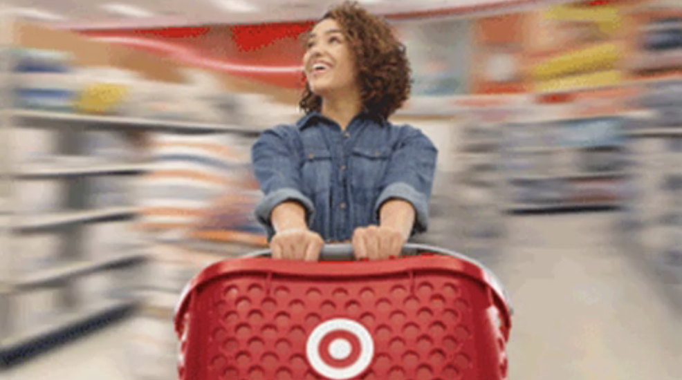 Someone holding a Target shopping basket while spinning around the store