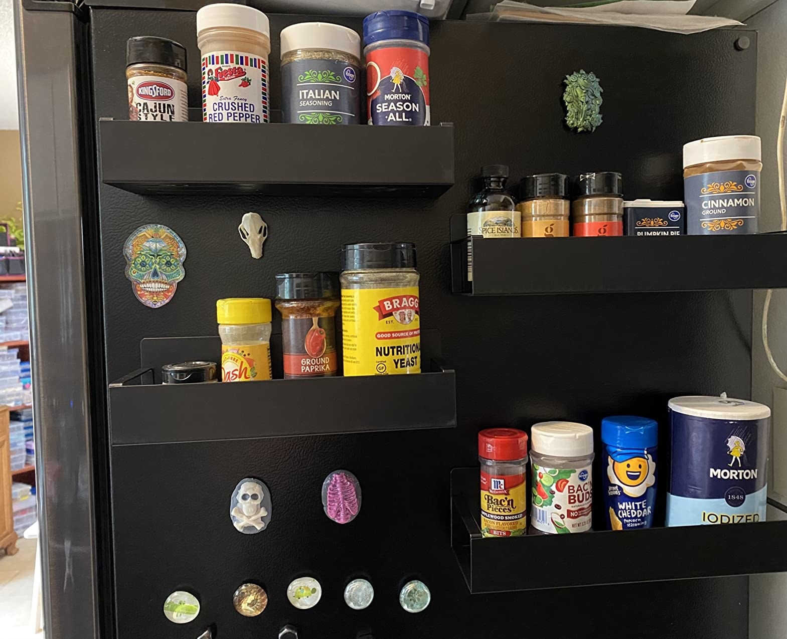 Four racks on side of reviewer&#x27;s fridge and storing various spices and cooking supplies