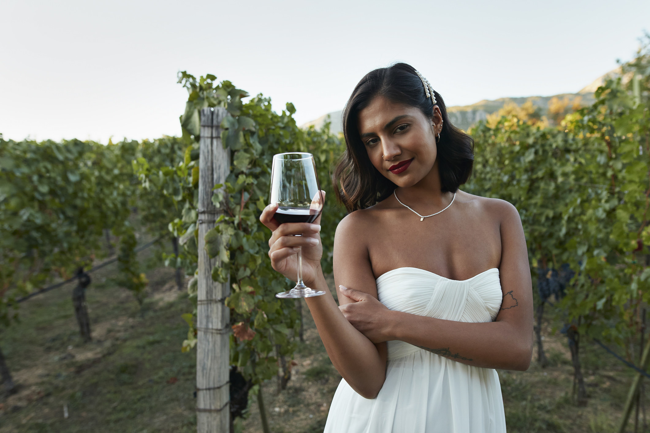 A bride holding a wine glass