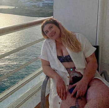 Reviewer wearing the white cover-up on a boat